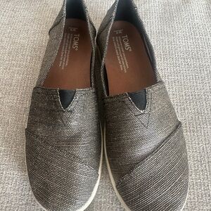 TOMS Black and gold slip on size 8